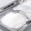 Color Prime DTF Powder photo showcasing direct to film powder poured onto metal tray in preparation for application