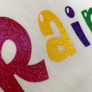 Prisma Sparkleshine Heat Transfer Vinyl on a design that reads "Rainbow" in rainbow colors.